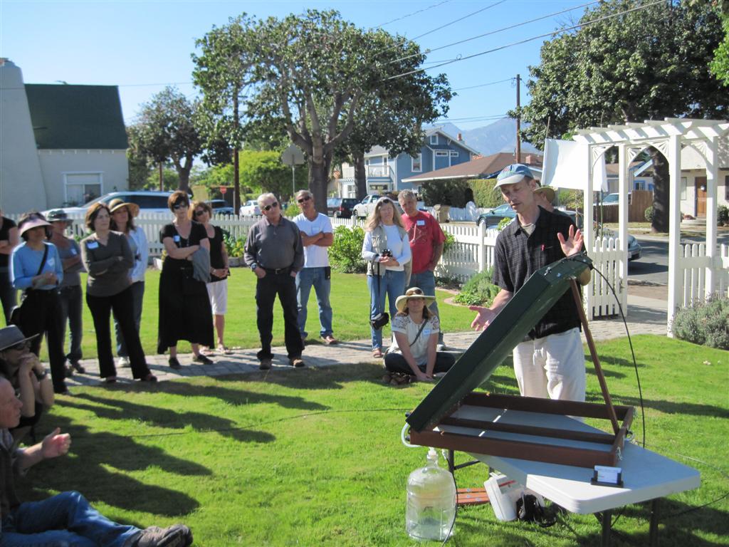 Photo of Eric Torbet, owner of Do-Right Solar, presenting the SWS-200 at the water-wise tour. View of Eric and the audience.